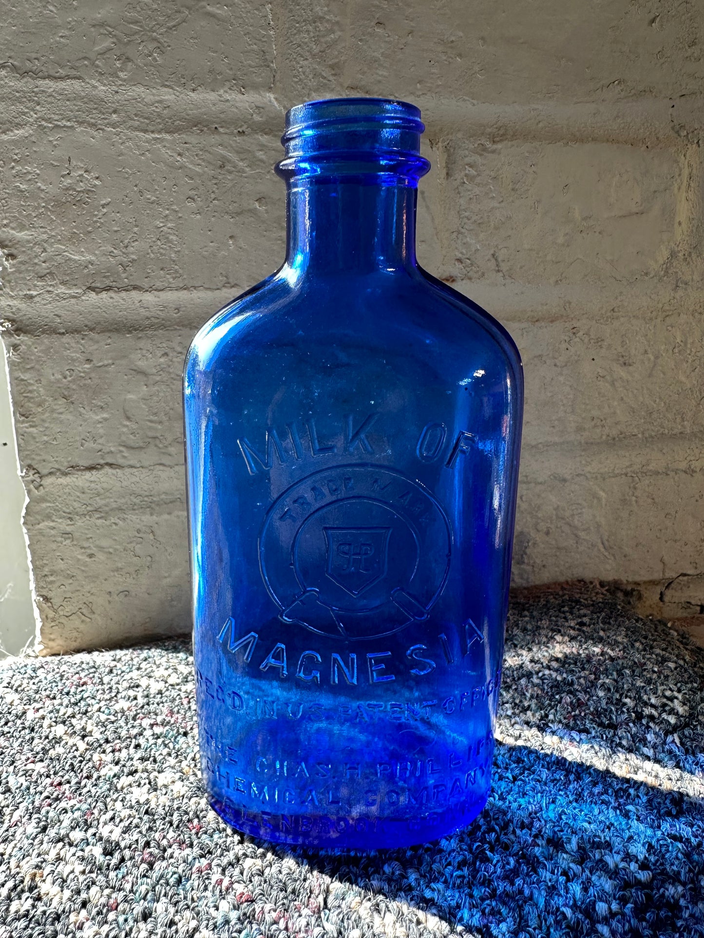 vintage cobalt blue milk of magnesia bottles