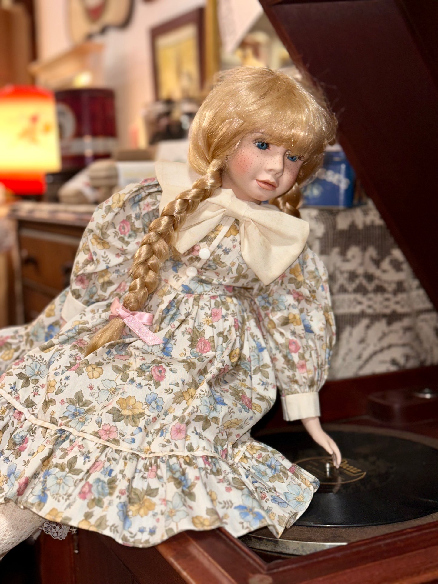 Vintage Porcelain Doll with Blonde Braids and Floral Dress
