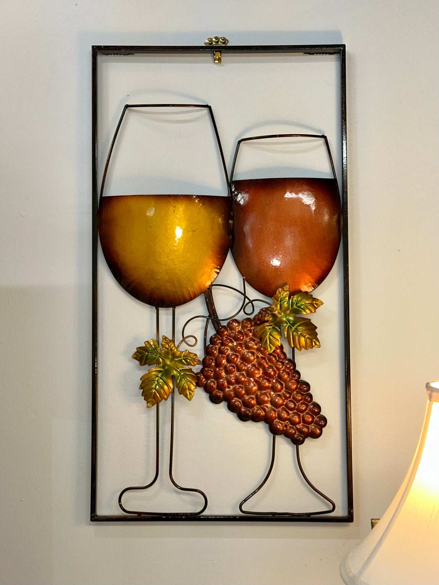 Framed vineyard themed metal wall art with wine glasses and grape cluster