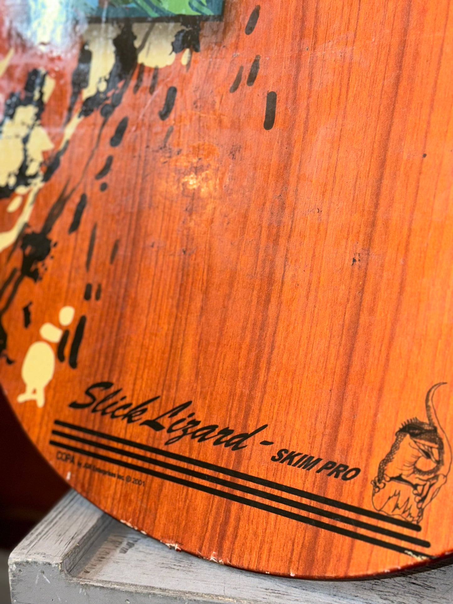 Wooden surf art with wave rider graphic