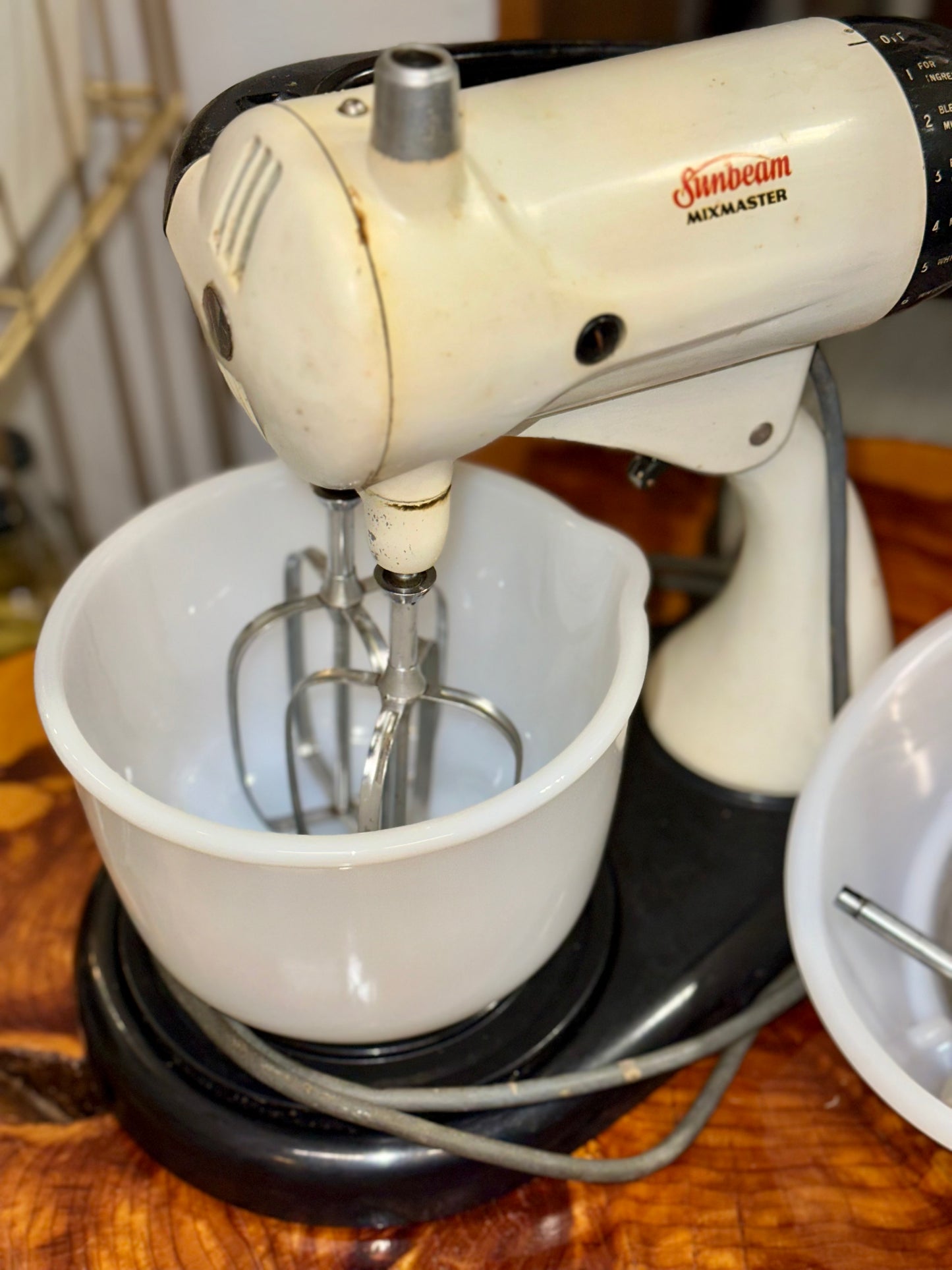 Antique-style Sunbeam Mixmaster kitchen appliance in classic cream and black design