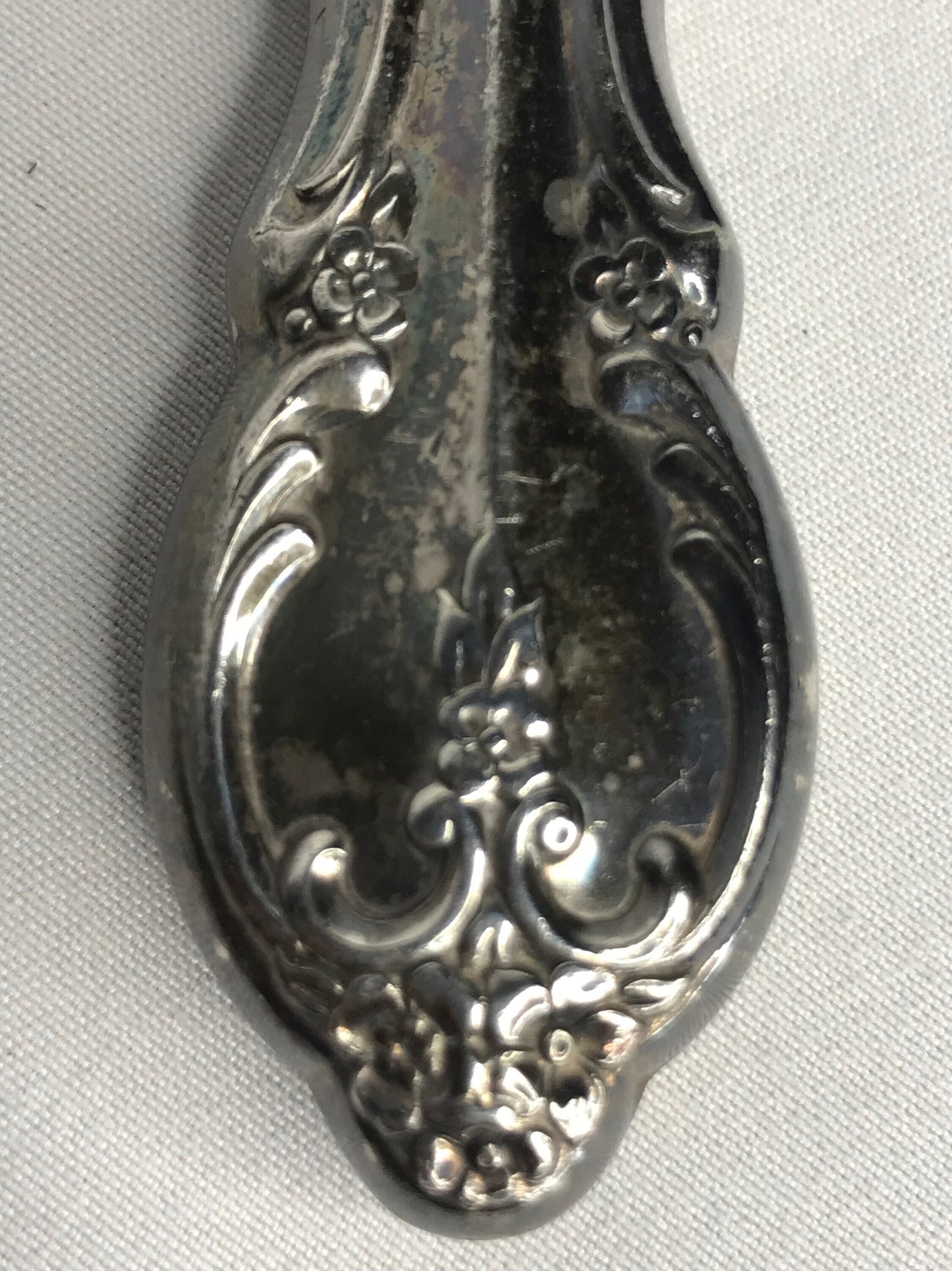 Aged silver plated Hallow knife 10-3/8" scrolls w/flower design