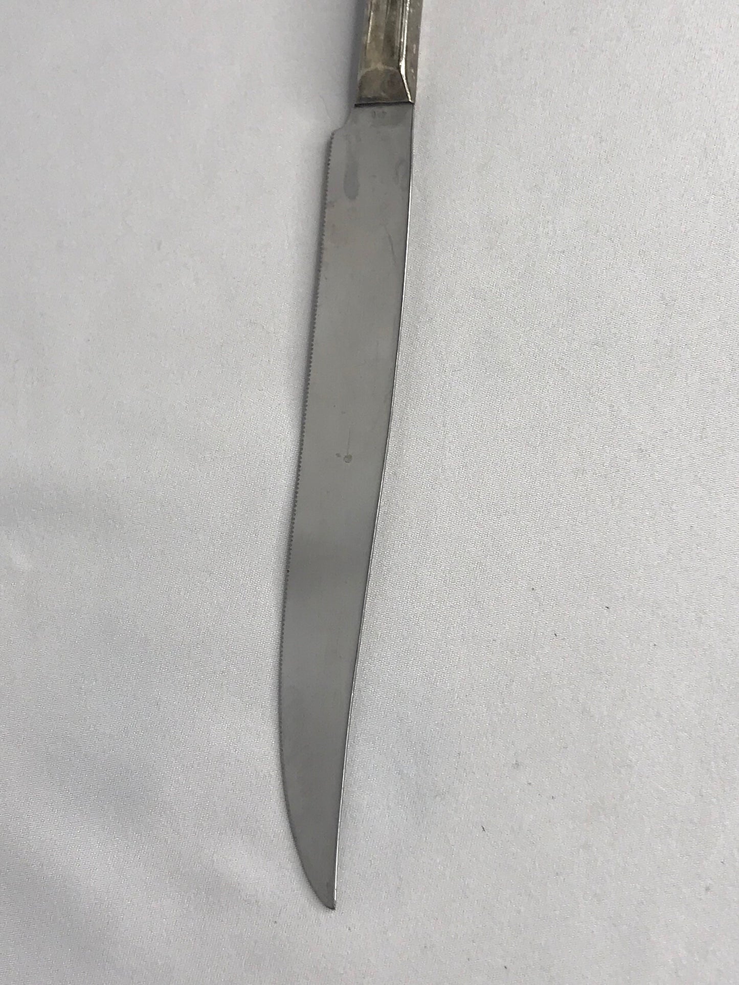 Aged silver plated Hallow knife 10-3/8" scrolls w/flower design