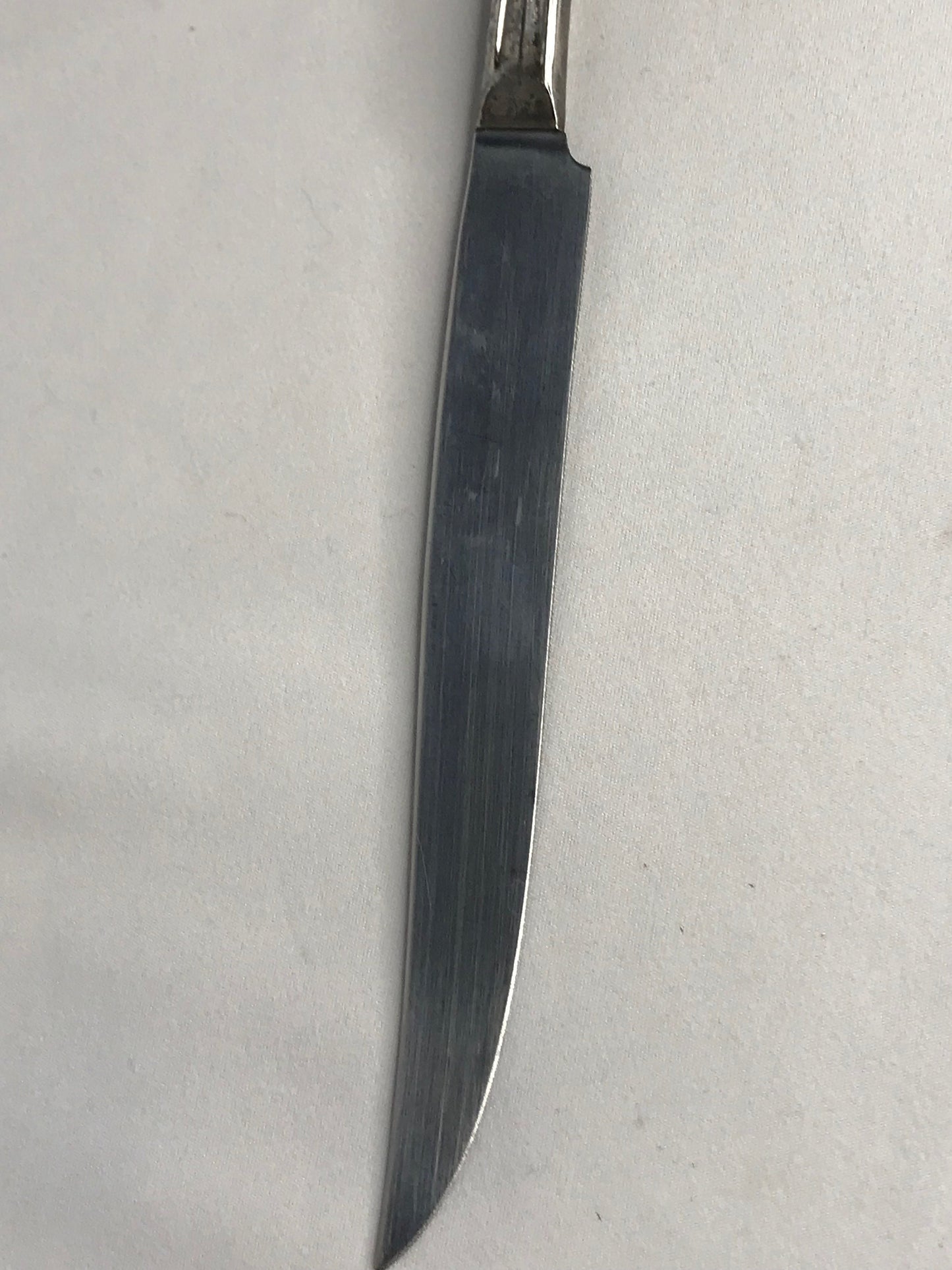 Aged silver plated Hallow knife 10-3/8" scrolls w/flower design
