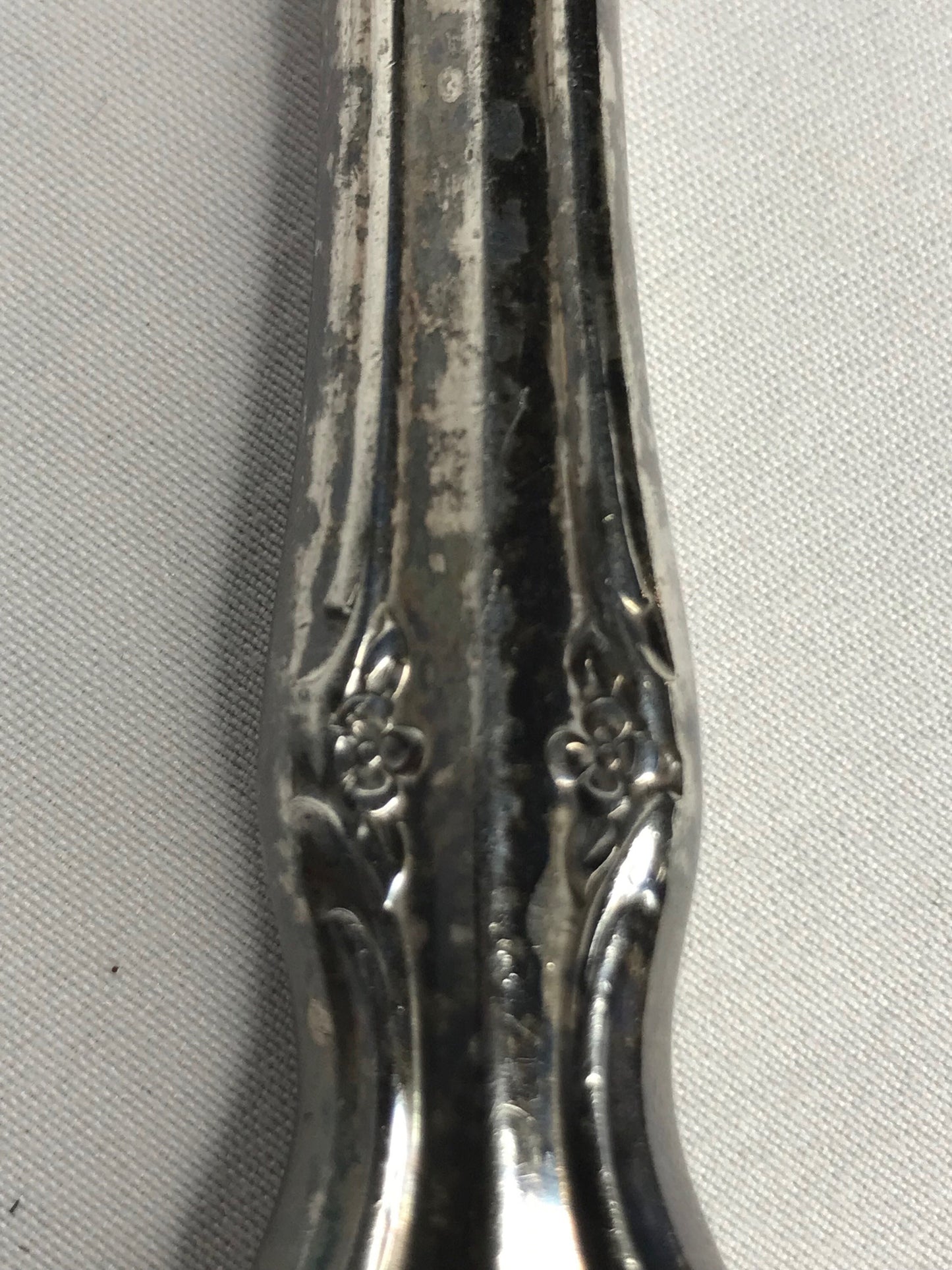 Aged silver plated Hallow knife 10-3/8" scrolls w/flower design