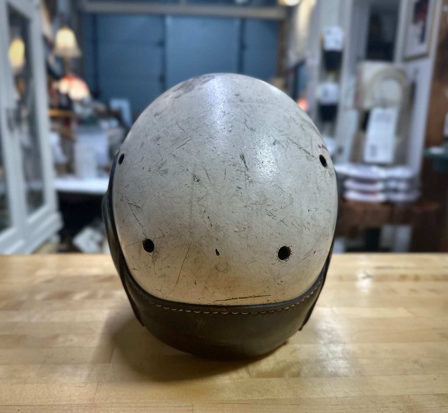 Back view of Vintage football helmet on a wooden surface