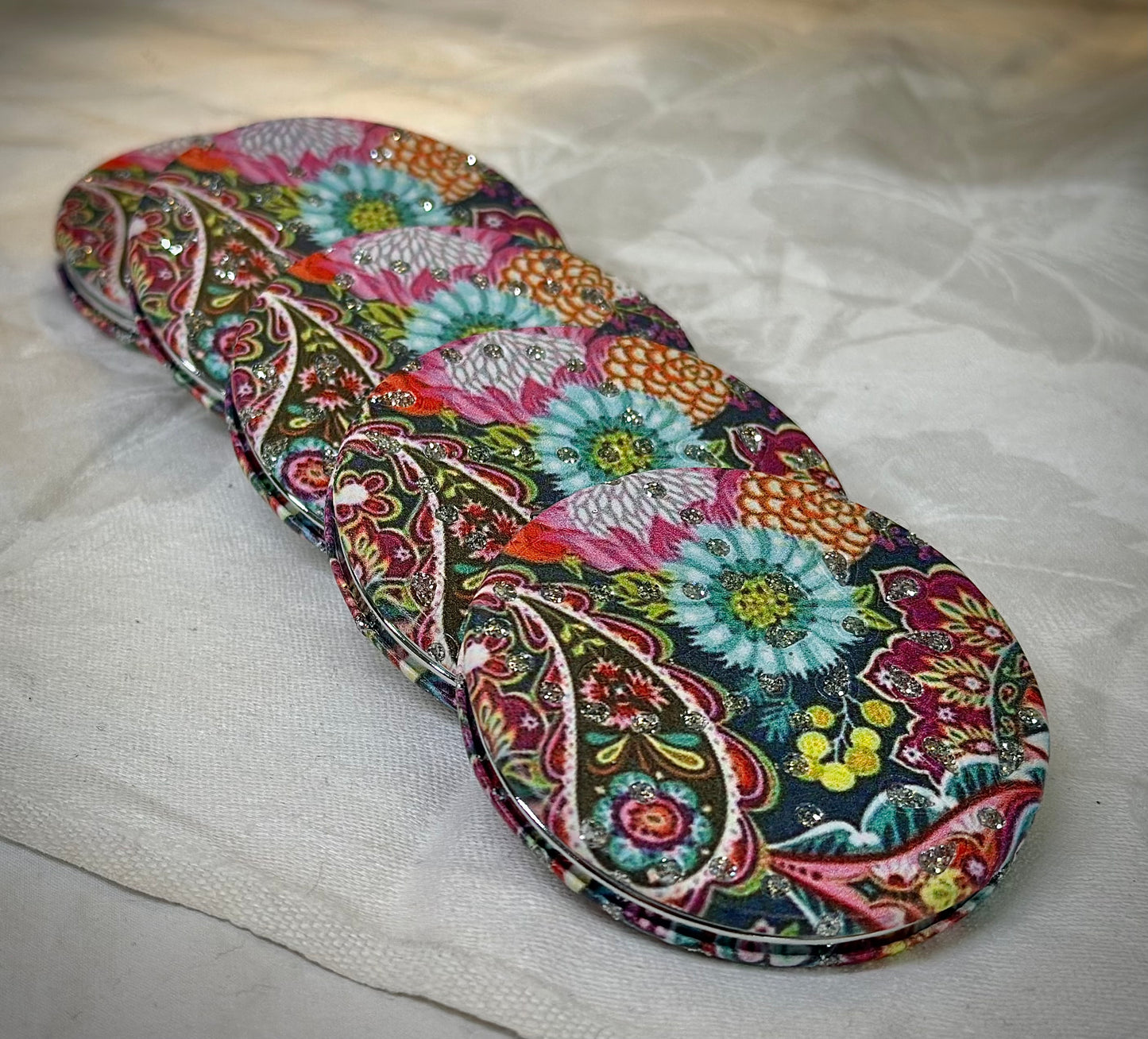 Elegant compact mirror with pink floral pattern