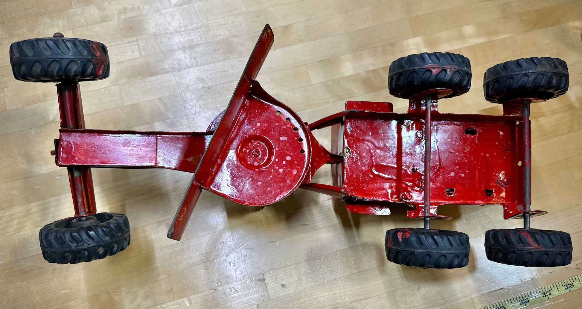 Classic vintage Nylint toy grader on display
