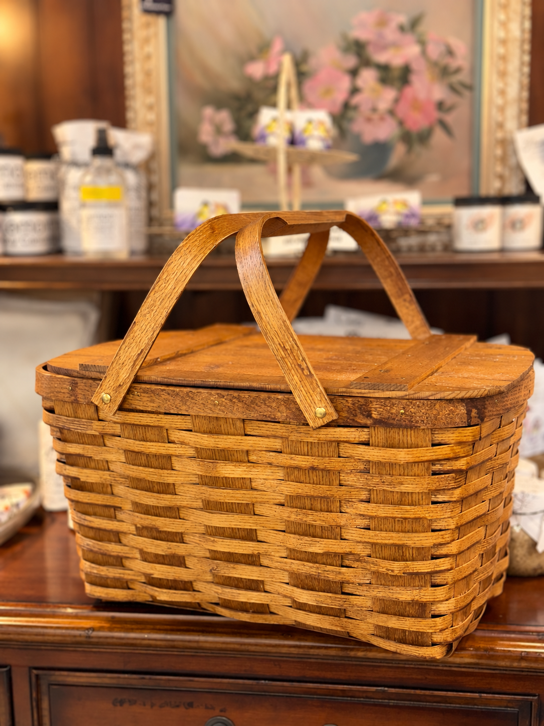 Vintage woven wood picnic basket with hinged lid and folding handles