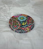 Floral compact mirror closed with intricate flower design