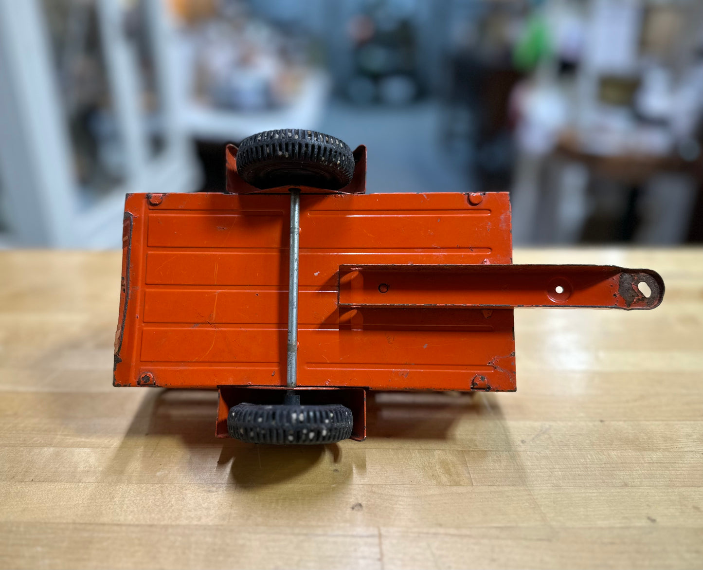 Close-up of metal and plastic parts on vintage U-Haul open trailer toy