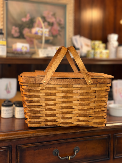 Top view of vintage wooden picnic basket with hinged lid