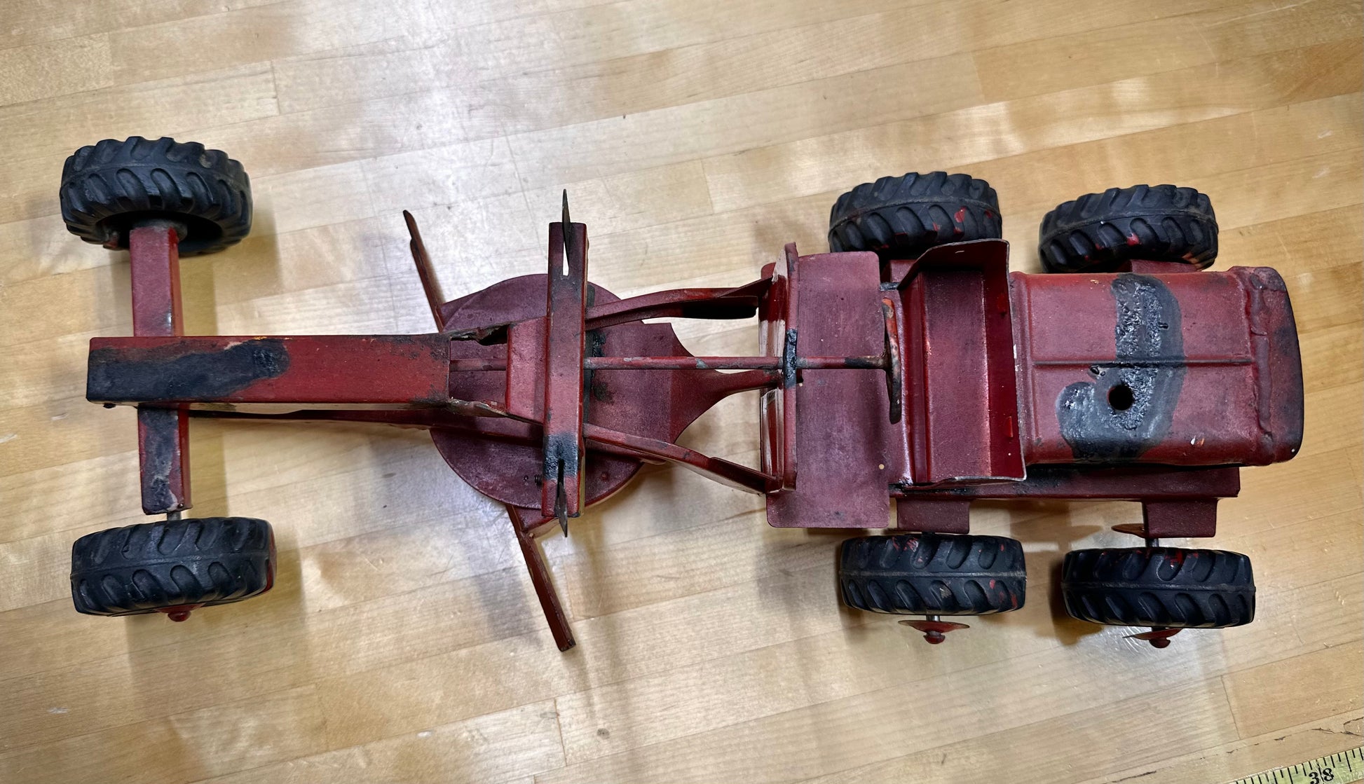 Classic vintage Nylint toy grader on display
