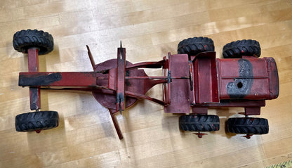 Classic vintage Nylint toy grader on display
