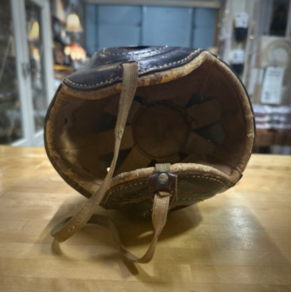 Inner view of Vintage football helmet on a wooden surface