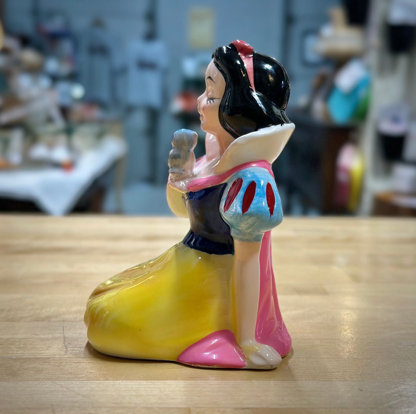 Side facing ceramic Snow White figurine