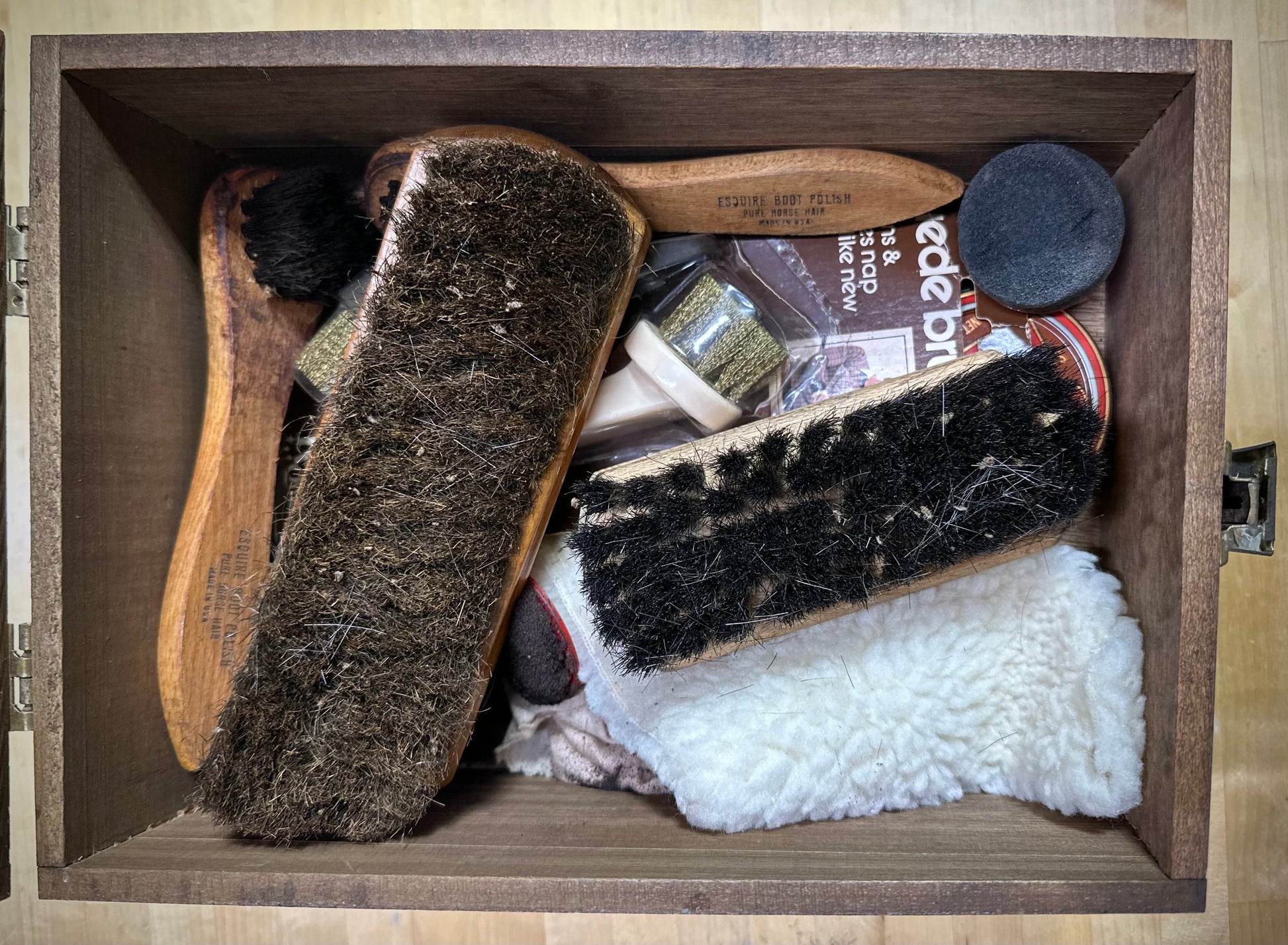 Vintage Kiwi Shoe Grooming Kit open display with brushes and polish tins