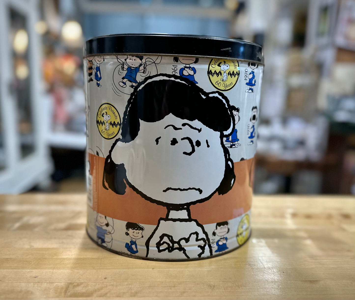 Side view of 2009 60th Anniversary Peanuts Popcorn Tin showing Lucy Artwork