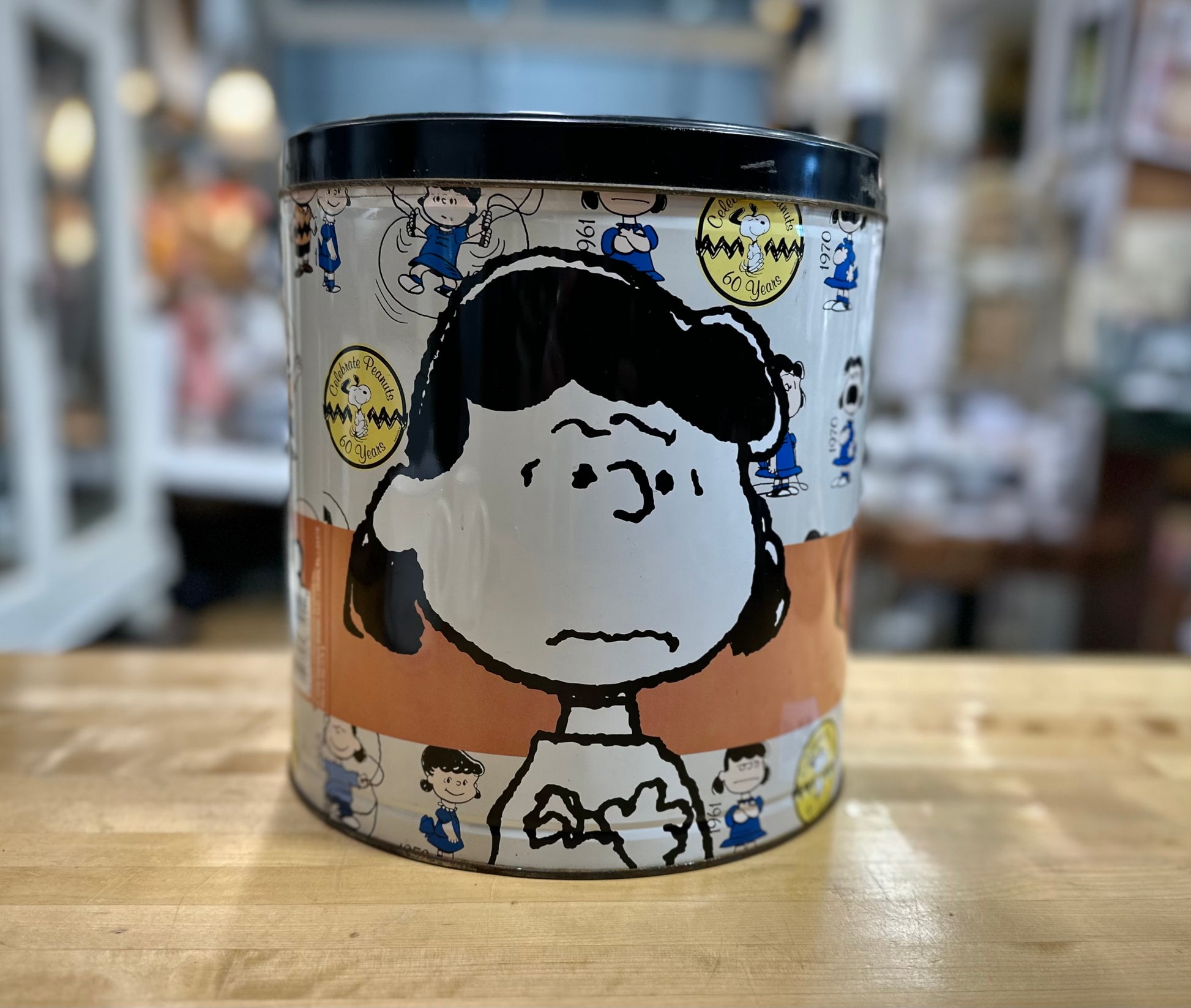 Side view of 2009 60th Anniversary Peanuts Popcorn Tin showing Lucy Artwork