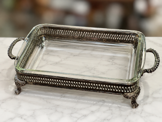 Vintage Pyrex glass baking dish in ornate silverplate serving caddy