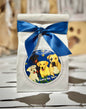 Treats by Tori blueberry dog treats in a white gift bag with blue ribbon