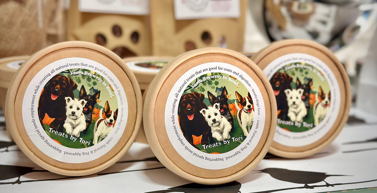 Treats by Tori natural dog treats packaged in labeled kraft tubs