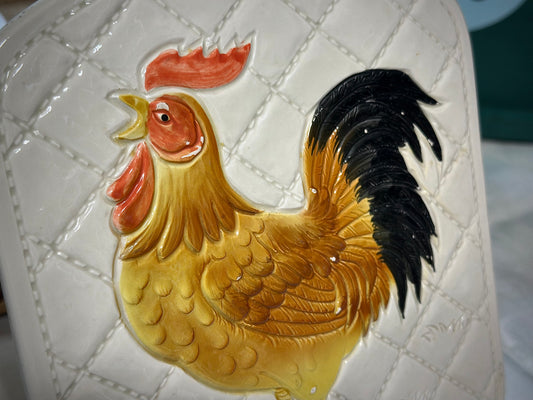 Vintage farmhouse rooster trivet close-up