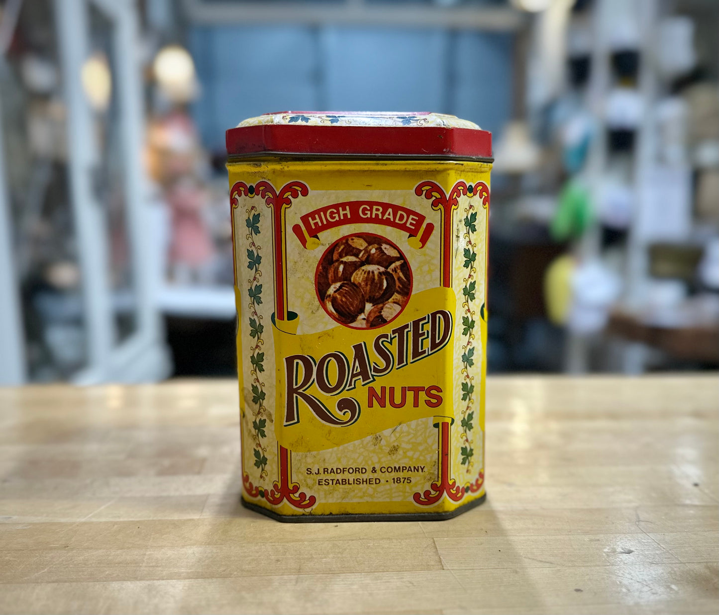 Side view of 1980’s S.J. Radford & Sons roasted nuts vintage tin