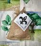 Community Coffee Café Special in a natural burlap bag with a white label