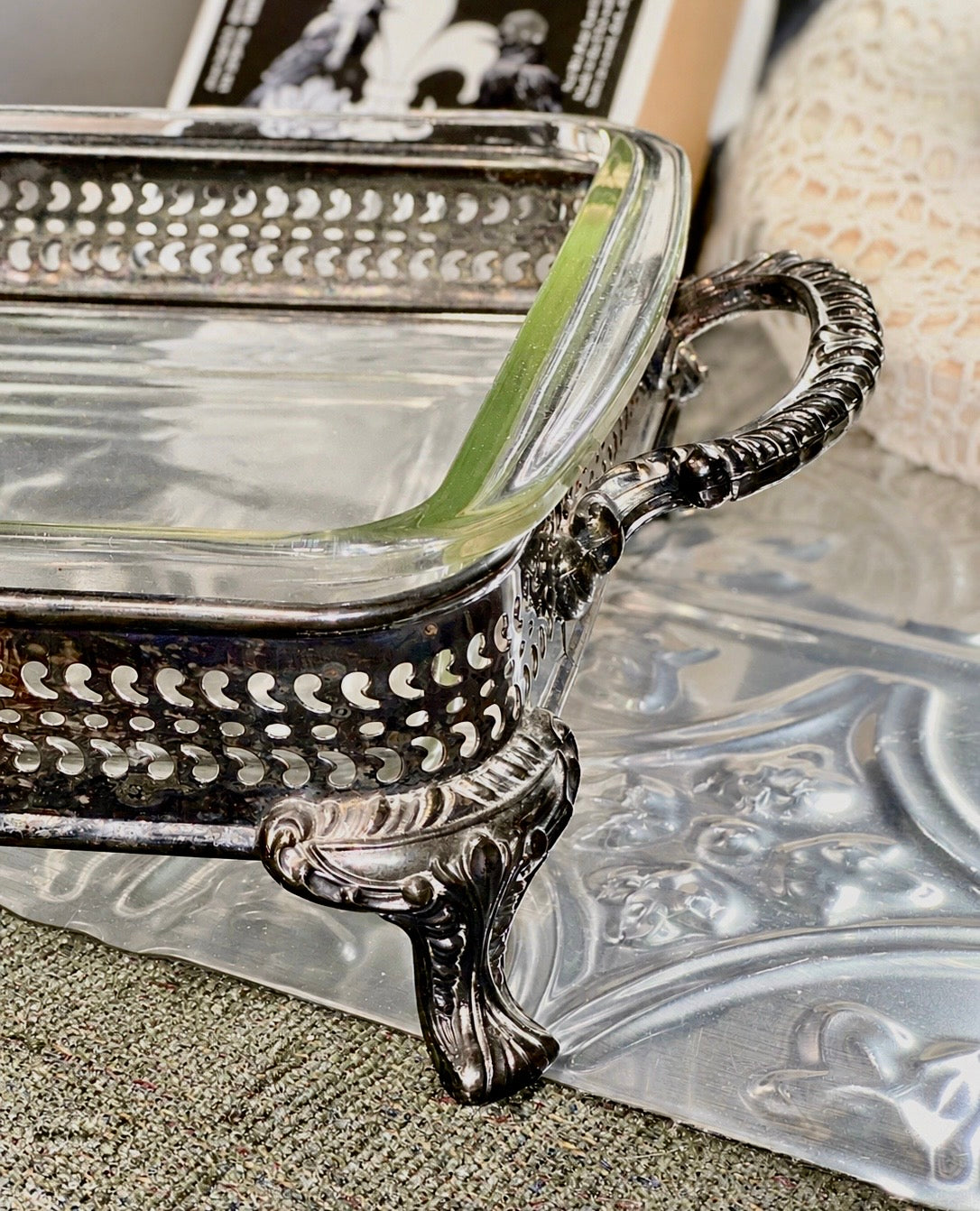 Clear Pyrex casserole dish with decorative silverplate handles