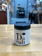 Dill Salt seasoning packaged in a clear glass jar with a black lid