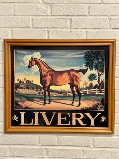 Framed LIVERY horse print featuring a chestnut horse in a countryside landscape with farm buildings and trees
