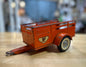 Vintage U-Haul Open Trailer Toy front view with orange and white colors