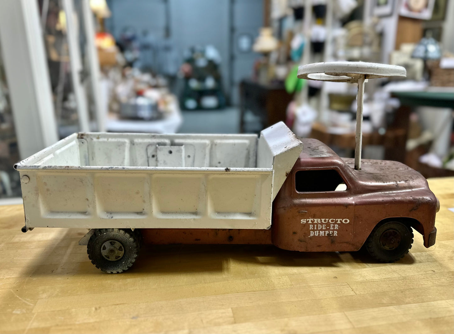 Side view of vintage Structo Ride-er Dumper Toy Truck without seat