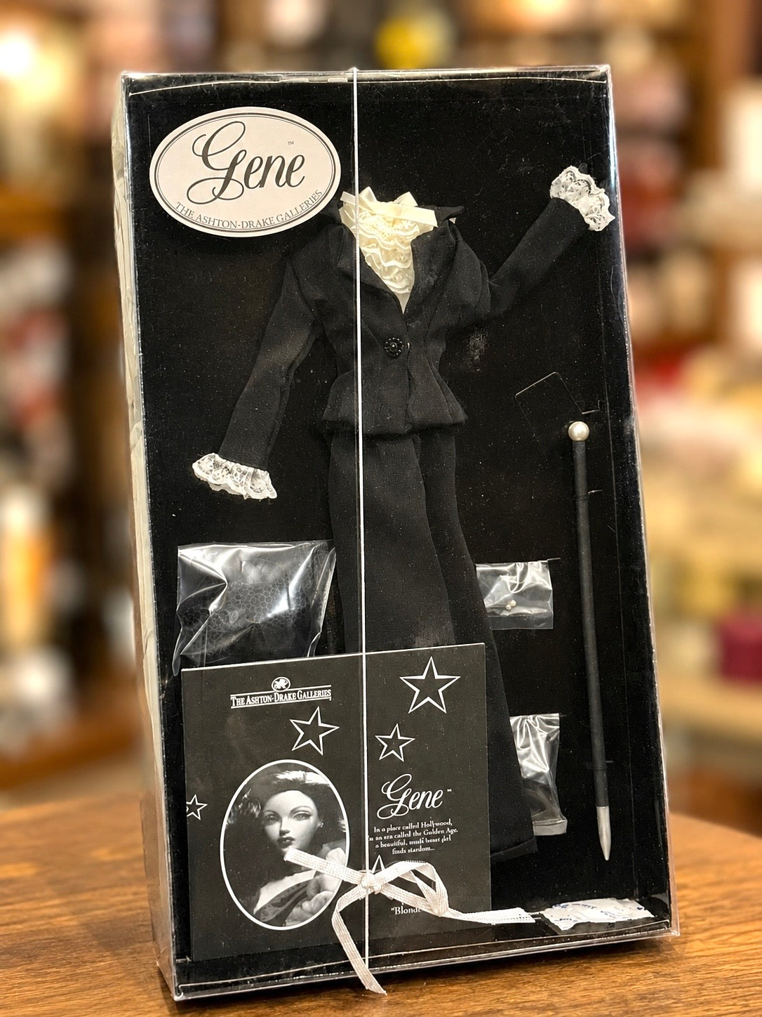 Ashton-Drake Gene wearing a black ensemble with delicate lace detailing