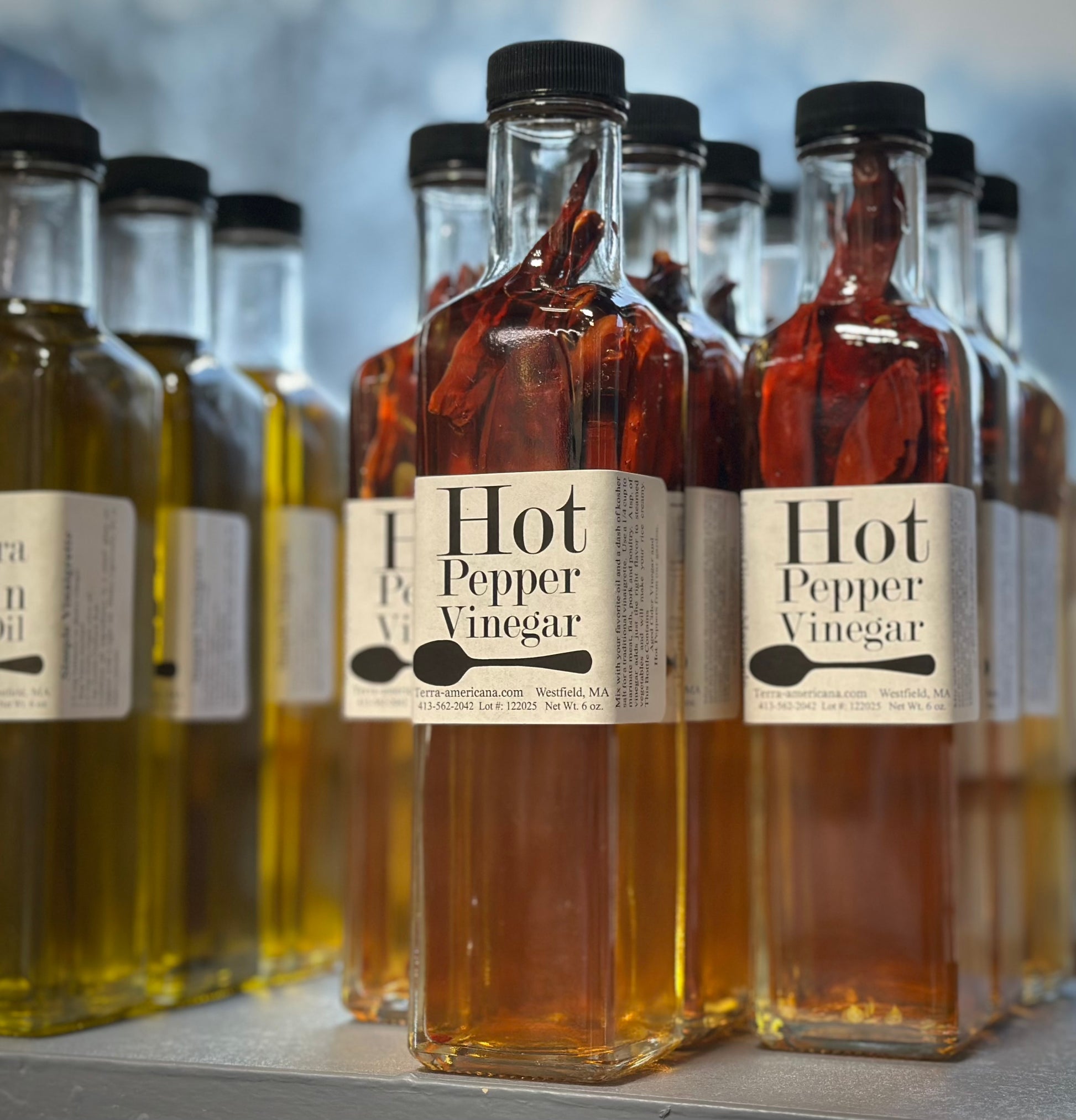 Artisan hot pepper vinegar with fresh hot peppers - gourmet spicy herbal vinegar