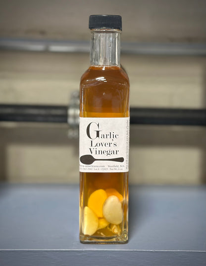 Artisan garlic lovers vinegar with fresh garlic cloves - gourmet herbal cooking vinegar