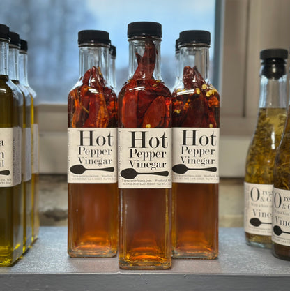 Hot pepper vinegar in mini wine bottle - fresh hot peppers in apple cider vinegar from Terra Americana