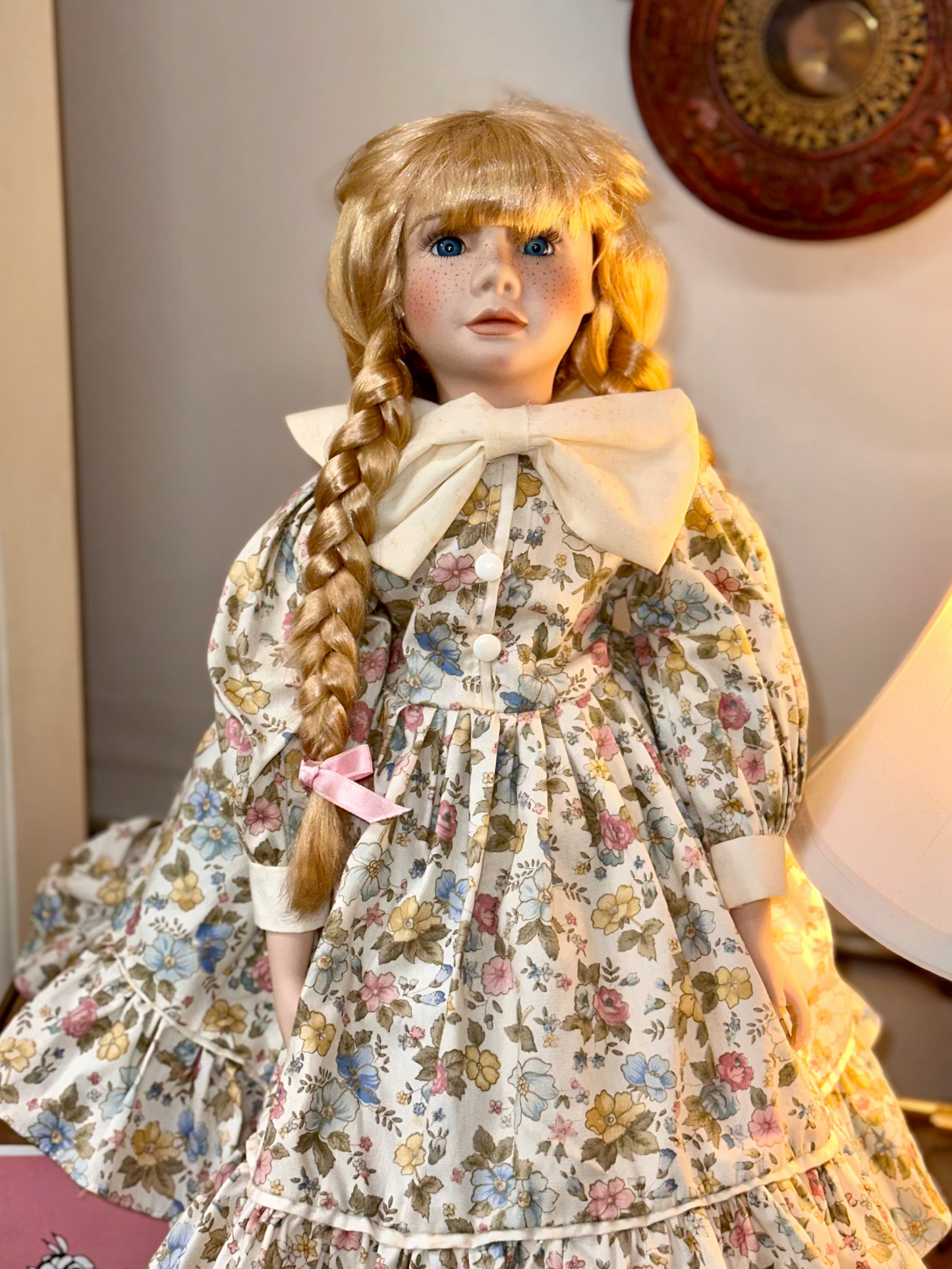 Vintage Porcelain Doll with Blonde Braids and Floral Dress