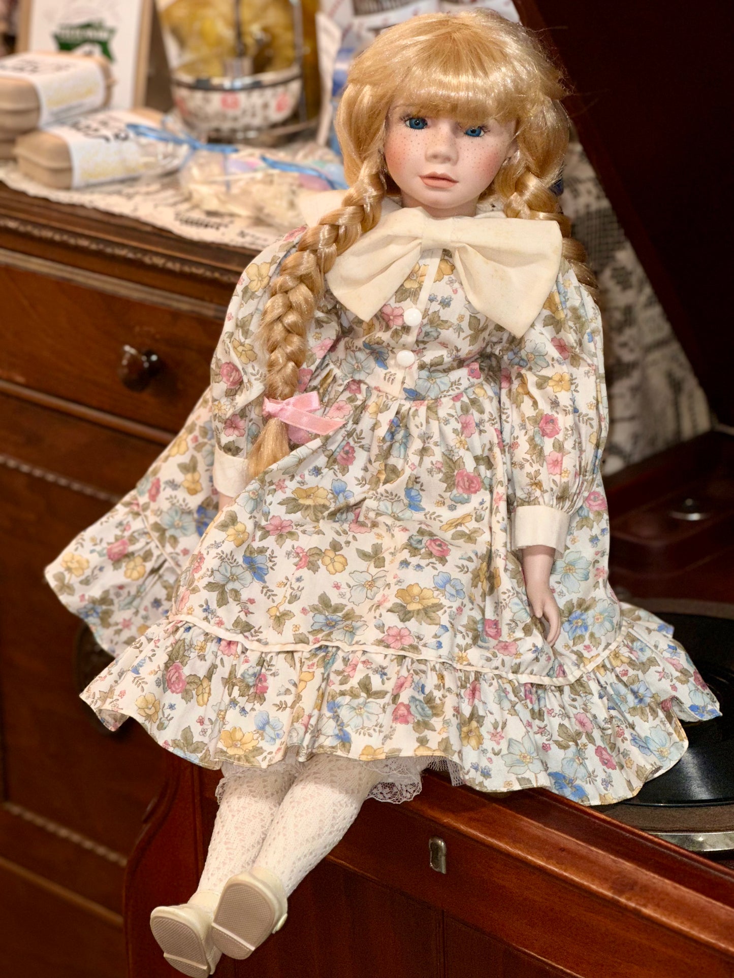 Vintage Porcelain Doll with Blonde Braids and Floral Dress