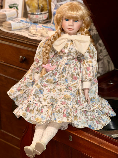 Vintage Porcelain Doll with Blonde Braids and Floral Dress
