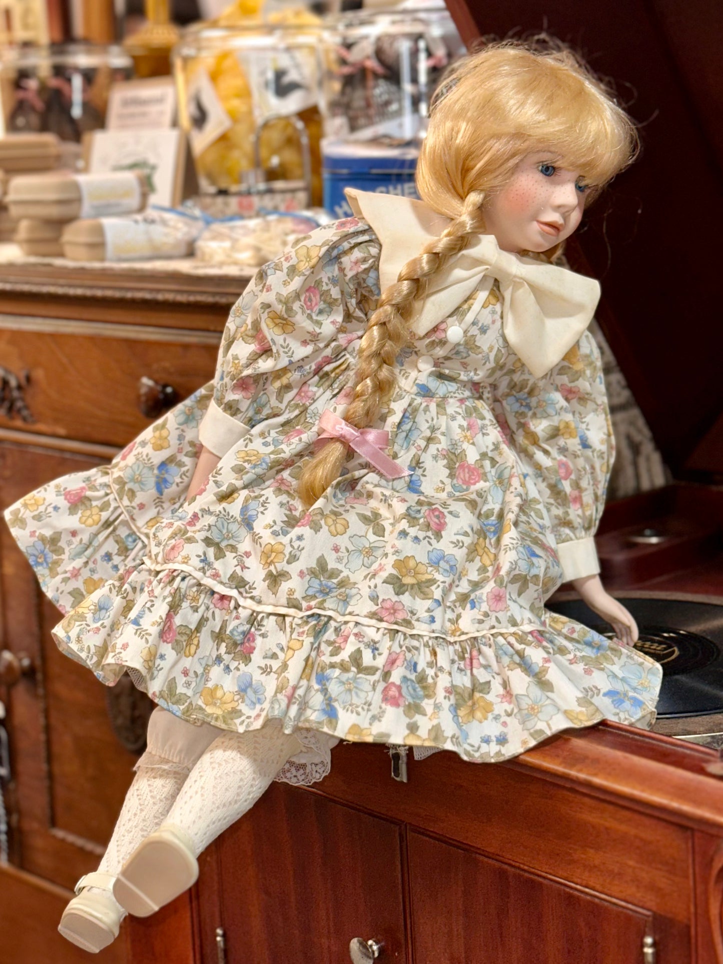 Vintage Porcelain Doll with Blonde Braids and Floral Dress
