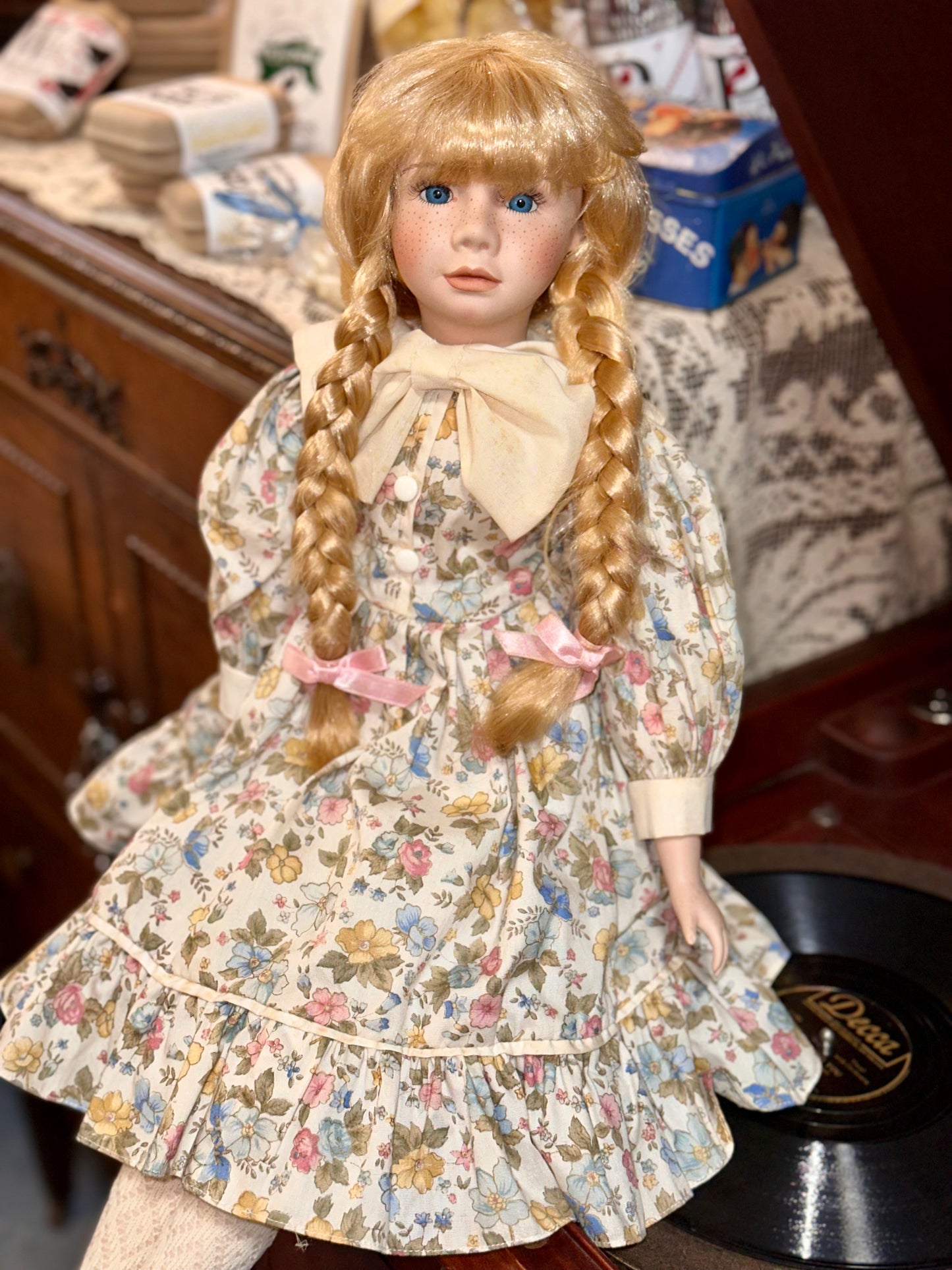Vintage Porcelain Doll with Blonde Braids and Floral Dress