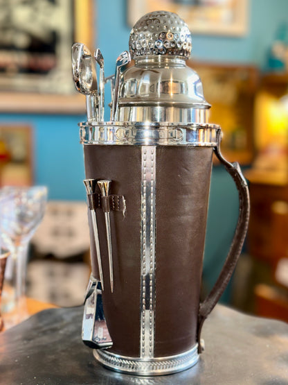 Side view of vintage golf bag cocktail shaker set showing handle and bar tools