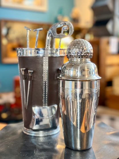 Vintage cocktail shaker removed from golf bag case showing interior and tool holders