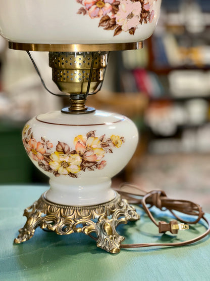 
Vintage cottagecore lamp glowing warm light milk glass floral design