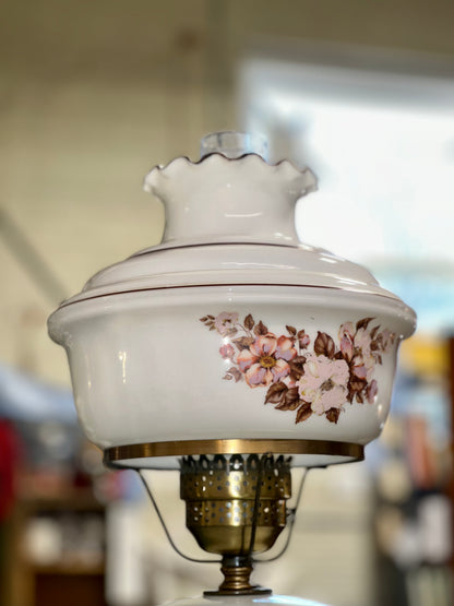 Antique style milk glass lamp with pink flowers and scalloped top shade