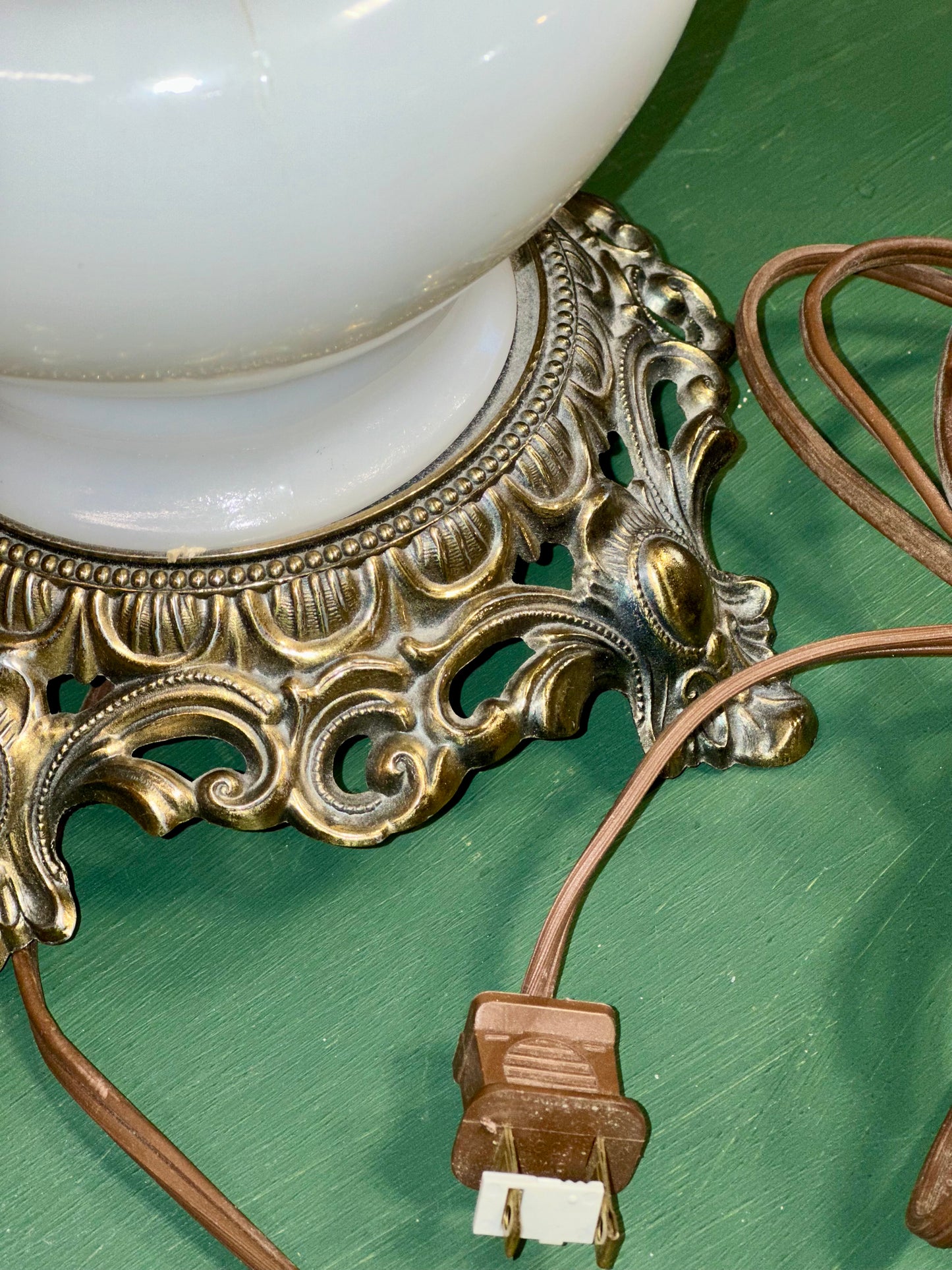 Ornate brass base vintage lamp with white milk glass floral shade detail