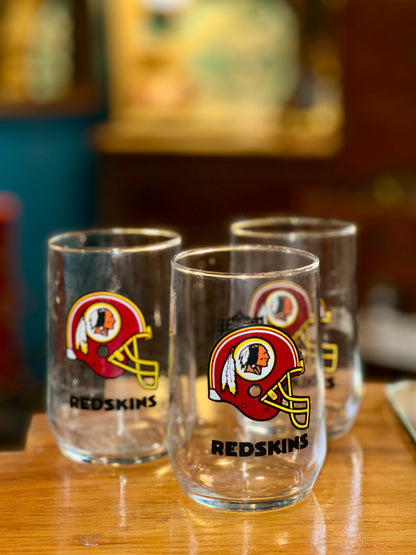 Vintage NFL Redskins football glasses on wooden table