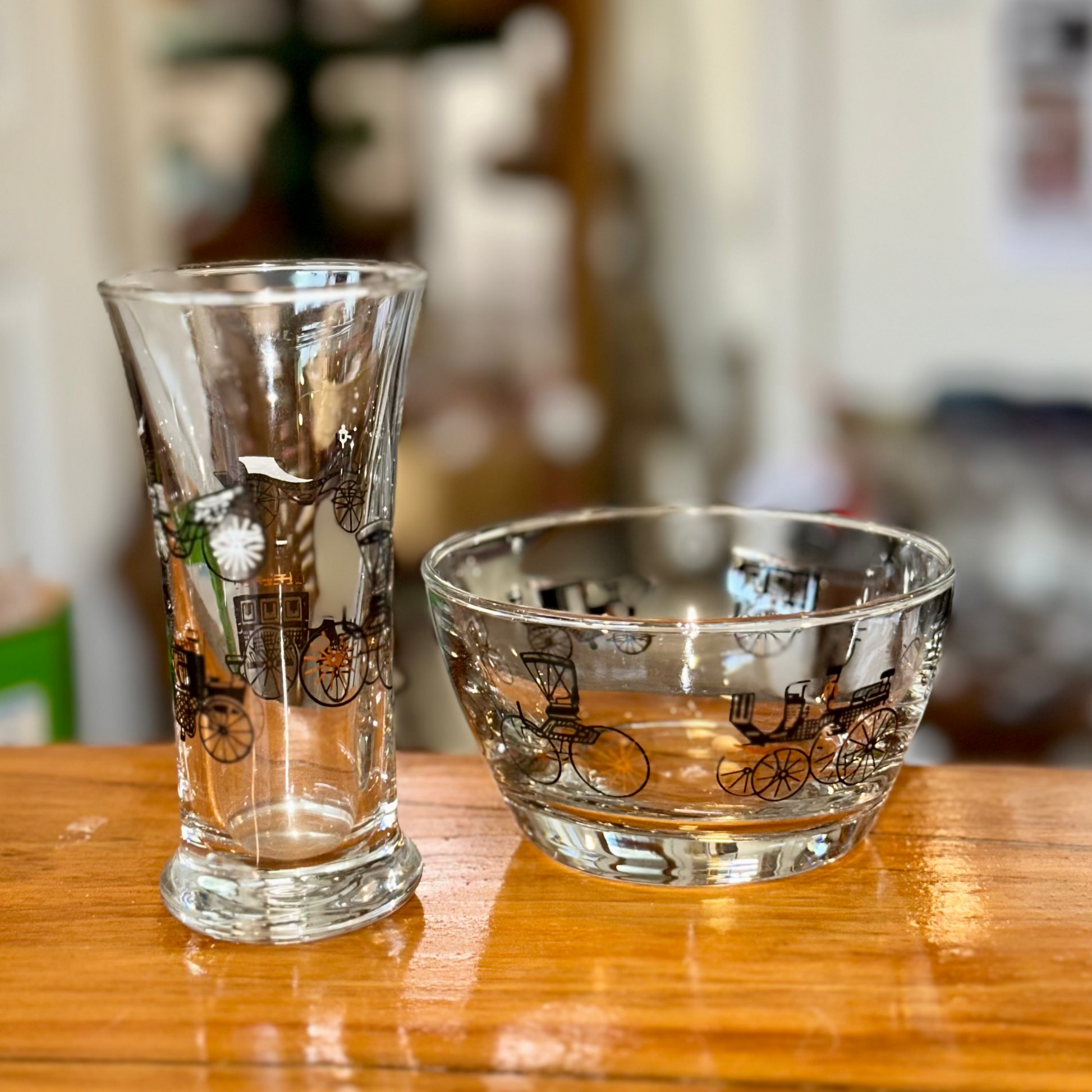 Vintage clear glass barware with black carriage graphics